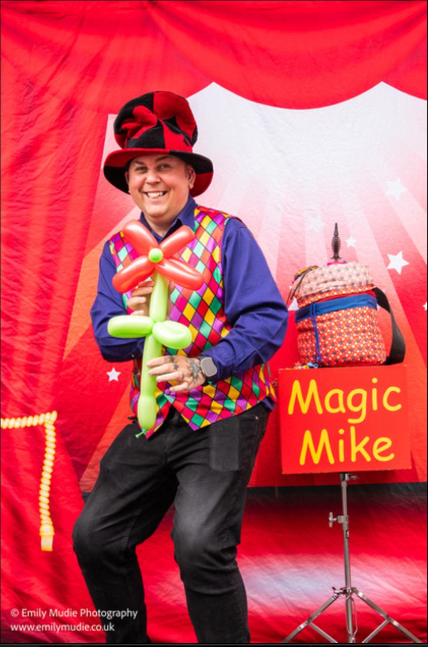 Magic Mike performing for children